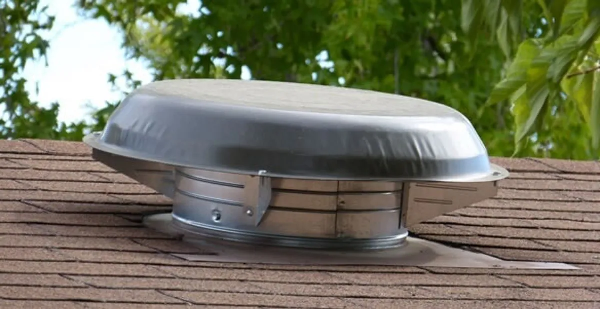 attic fan installation services with low-profile roof ventilation unit in Evansville, IN