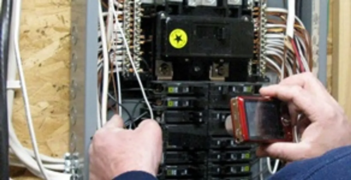 Home electrical inspection of circuit breaker panel by licensed electrician in Evansville, IN